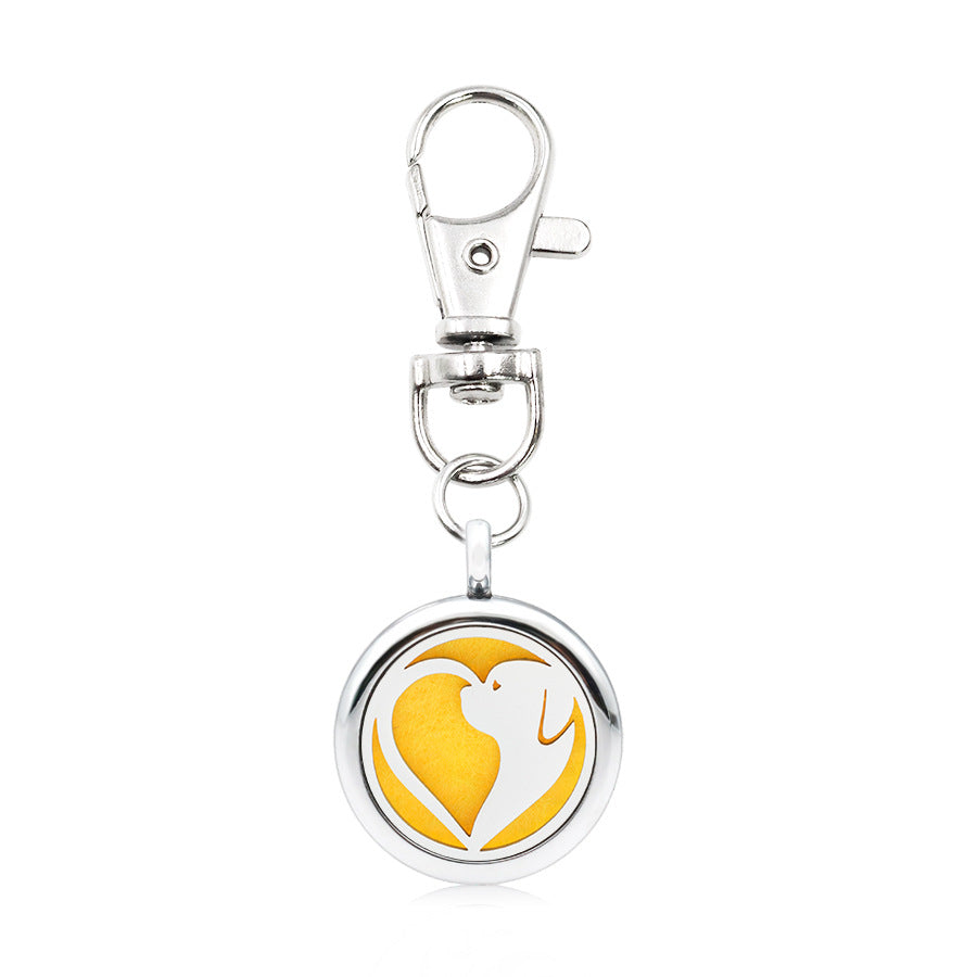 Wholesale Alloy Angel Wings Hollow Aromatherapy Essential Oil Keychain